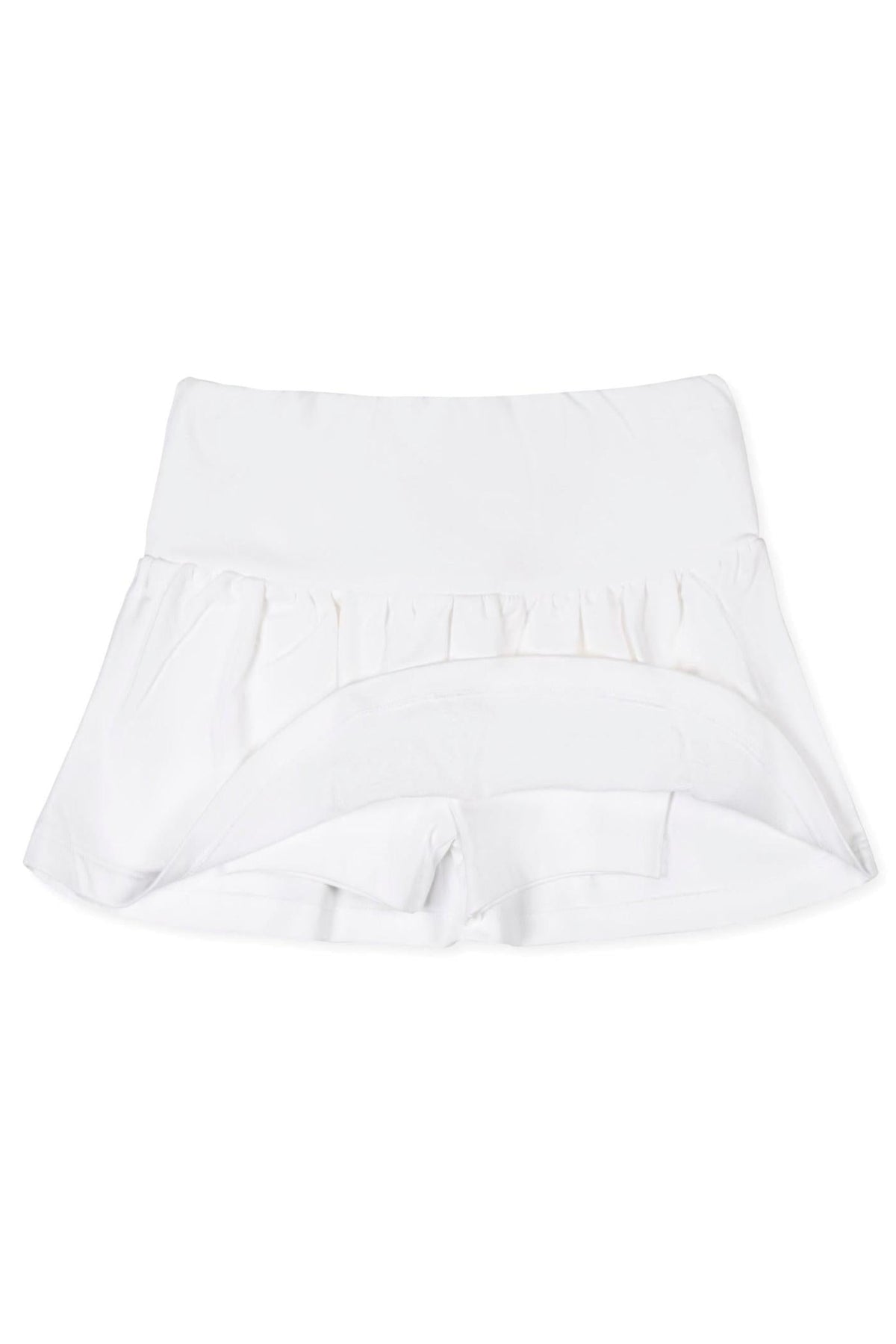 White organic cotton skort featuring a flouncy skirt and an elastic back waist. Designed for comfort and play, it’s suitable for children ages 2T to 12.