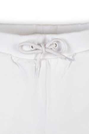 Close-up of white organic cotton French terry shorts featuring an elastic waistband and faux drawcord. The soft fabric is designed for comfort, suitable for toddlers and kids.
