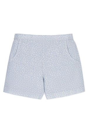 Light blue linen pull-on shorts featuring a delicate white floral pattern, designed for toddlers and kids, with side pockets.