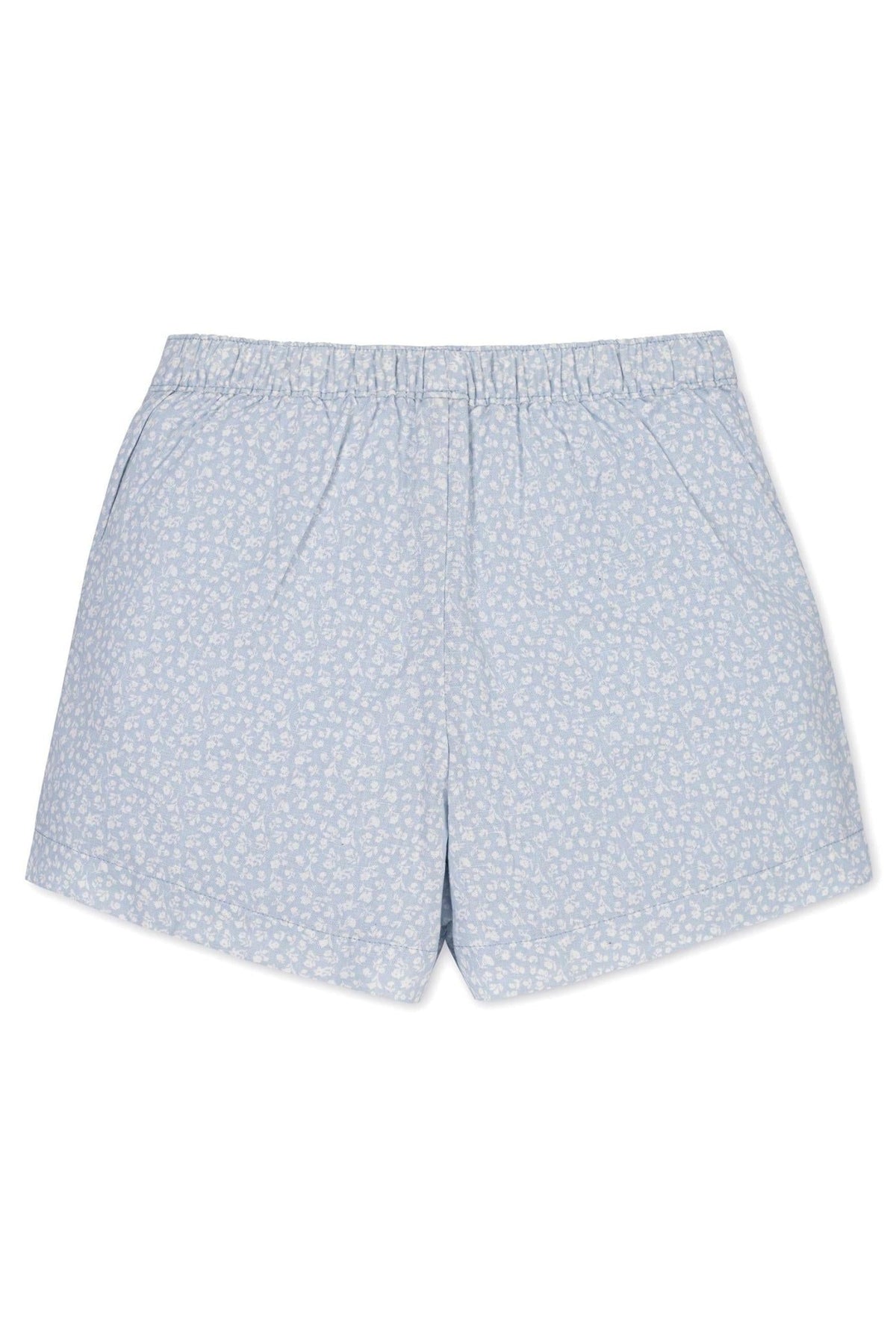 Light blue linen shorts featuring a delicate white floral print, designed for comfort with an elastic waistband for kids.