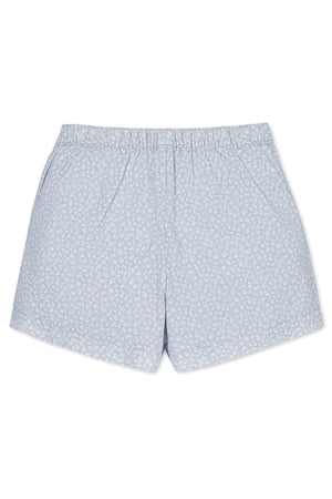 Light blue linen shorts featuring a delicate white floral print, designed for comfort with an elastic waistband for kids.