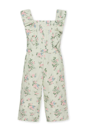 Light green floral jumpsuit featuring flutter sleeves, button front closure, and wide legs, made from organic cotton.