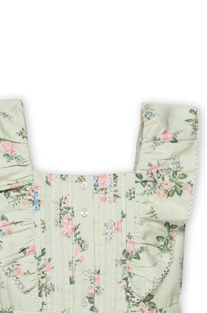 A close-up of a light green floral jumpsuit featuring flutter sleeves, button details, and delicate lace trim. Ideal for girls.