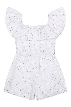 A white organic cotton seersucker romper features a ruffle collar and black dot patterns. Designed for toddlers and kids.