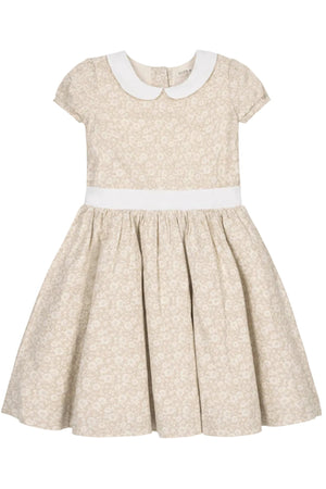 A sandy floral dress by Hope & Henry features a Peter Pan collar, puff sleeves, and a pleated waist sash.