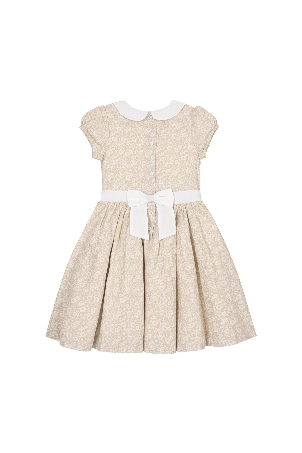 A sandy floral dress features a white Peter Pan collar, puff cap sleeves, and a bow-tied waist sash.
