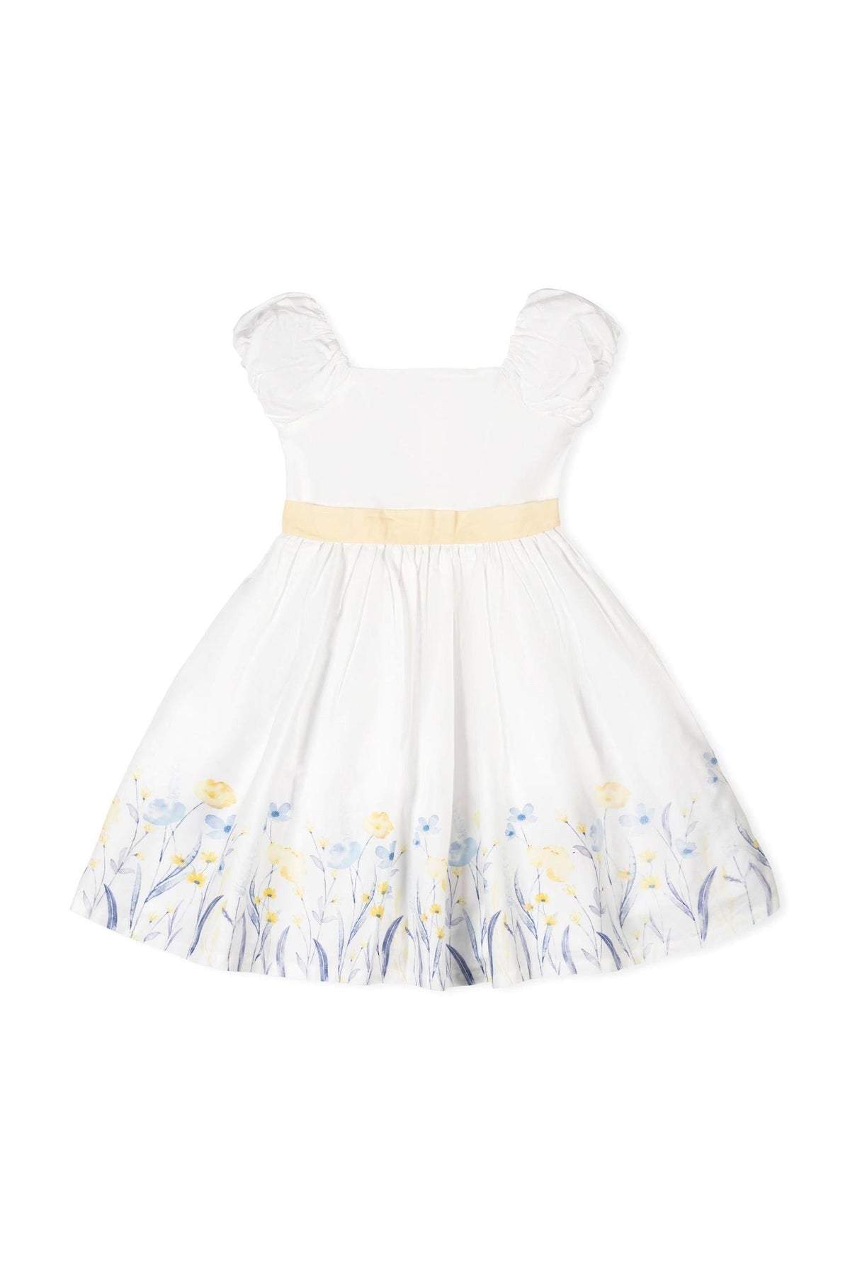 A white organic cotton dress features feminine puff sleeves and a yellow waist sash. The skirt is adorned with delicate floral patterns in blue and yellow, perfect for special occasions.