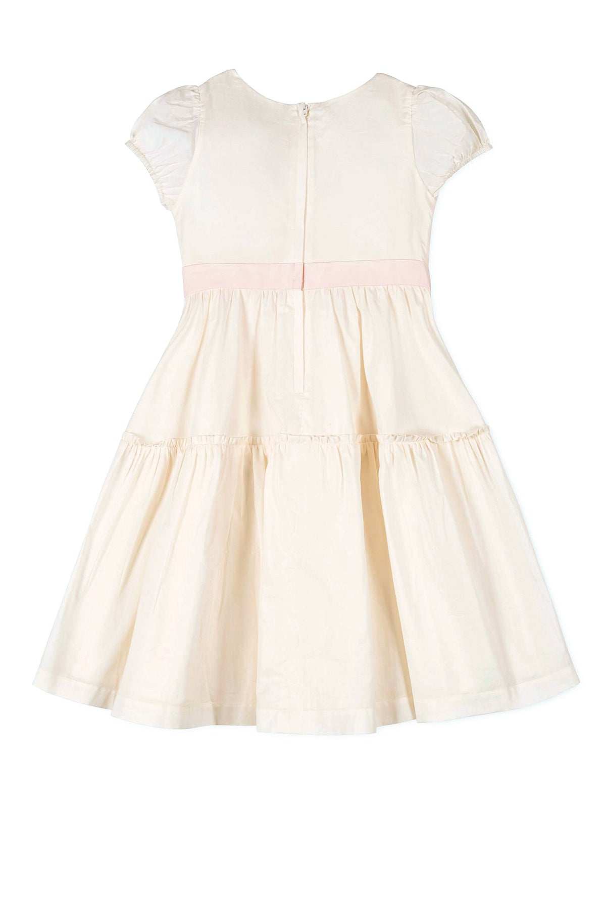 Cream-colored girls dress with puff sleeves, pink waist sash, and tiered skirt. Features a back zipper closure.