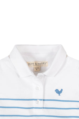 Close-up of a white polo dress with blue stripes, featuring a collar, button placket, and a blue embroidered rooster logo.