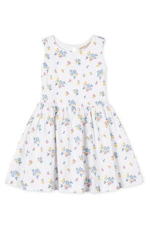 White tank dress featuring a floral pattern in soft blue, pink, and yellow hues, made from organic cotton.