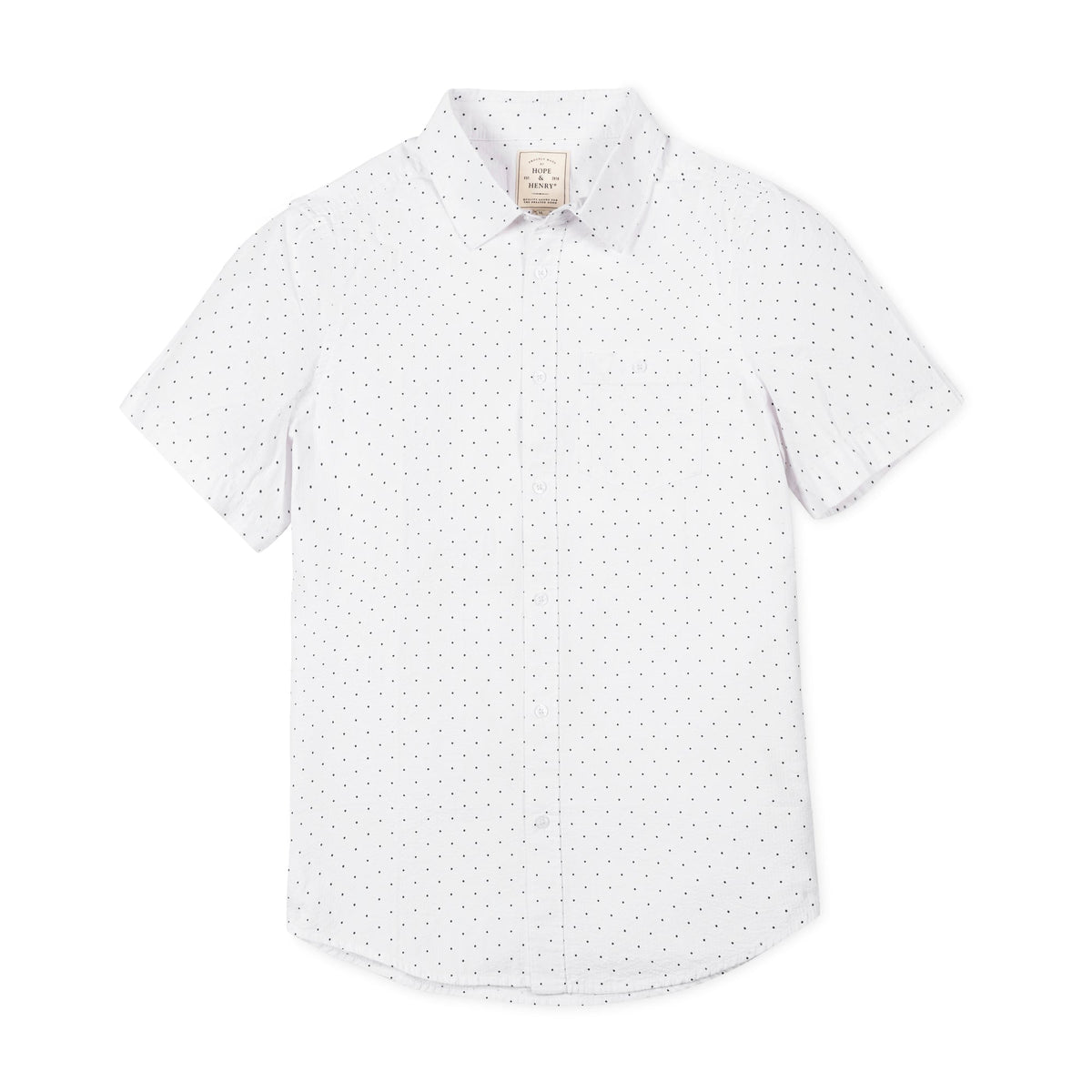 Short sleeve white shirt featuring a subtle black polka dot pattern. Made from organic cotton, this comfortable shirt is perfect for warm weather and casual outings.