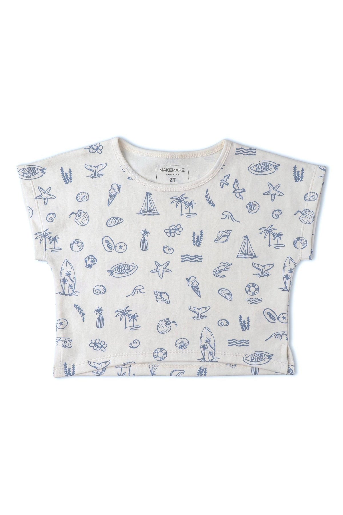 A light beige drop shoulder tee featuring a whimsical coastal print of seashells, sailboats, and seaweed in blue.