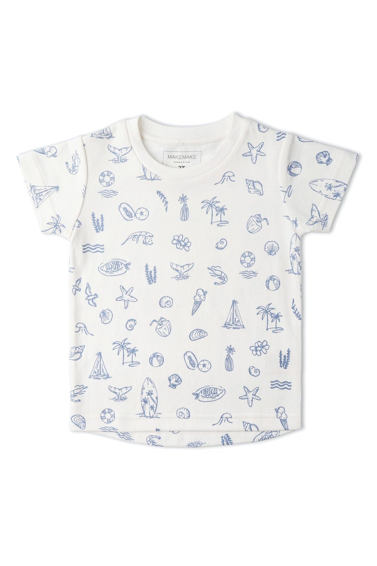A white short-sleeve tee features a playful coastal print with blue illustrations of seashells, surfboards, and marine life. Made from soft organic cotton, its ideal for summer adventures.