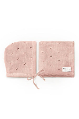 Pink organic pointelle swaddle blanket and hat set with delicate knit pattern, labeled Bleu La La Organics.