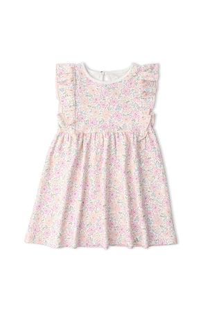 A charming peony-patterned flutter dress features ruffled sleeves and a soft neckline. Made from organic cotton, this playful dress is perfect for baby girls, showcasing a delightful floral design.
