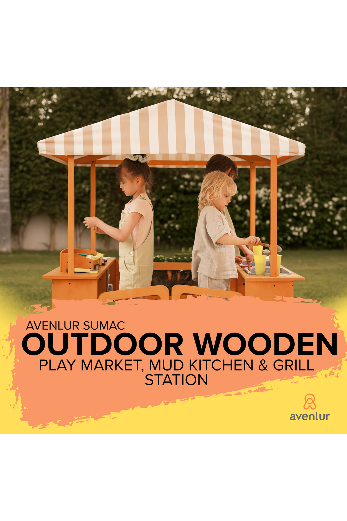 Two children play at the Avenlur Sumac outdoor wooden market and mud kitchen station, featuring a striped canopy and colorful play accessories, set against a lush green garden backdrop.