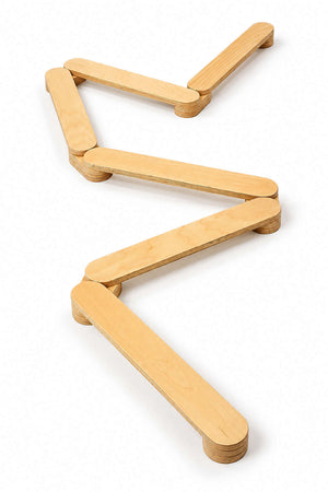 A zigzag arrangement of six light wood balance beams showcases a sustainable design. The beams are crafted from high-quality wood, ideal for childrens active play and motor skill development.