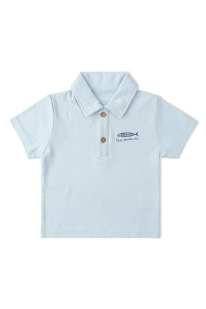Light blue organic cotton polo shirt featuring a classic collar and wooden buttons. It has a playful fish embroidery, perfect for casual wear and eco-friendly fashion for children.
