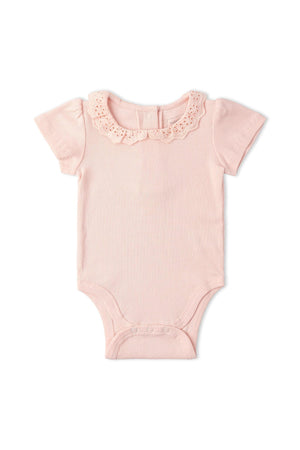 Organic lace collar onesie in soft blush color, featuring a ribbed texture and short sleeves. Designed for comfort and movement, perfect for playtime or naptime.