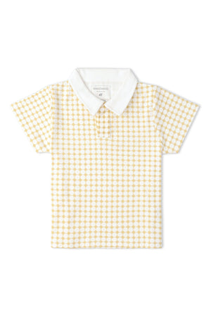 A short-sleeved collar tee featuring a yellow and white dot pattern. Made from soft organic cotton, this shirt is perfect for kids playtime and sunny adventures.