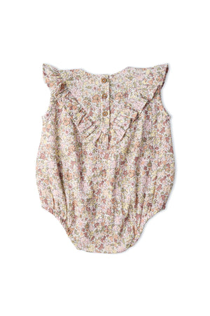 A pastel floral bubble romper featuring a sleeveless design and ruffled neckline. Made from soft, breathable organic cotton, this romper is perfect for keeping little ones comfortable during playtime.