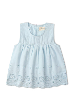 Light blue organic cotton top featuring delicate eyelet embroidery and a breezy silhouette. Ideal for warm-weather outings, this sleeveless design combines comfort with a charming, intricate style.