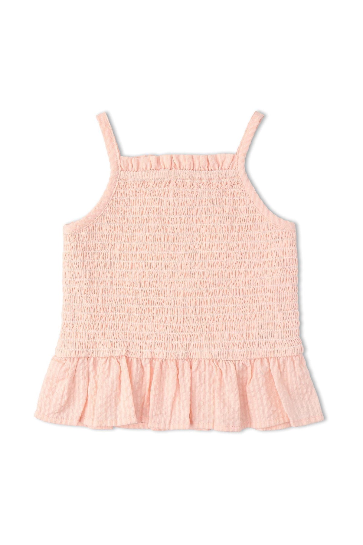 Light blush smocked top with delicate ruffles and adjustable straps, made from organic cotton seersucker fabric, perfect for warm days. Ideal for stylish, eco-conscious childrens wear.