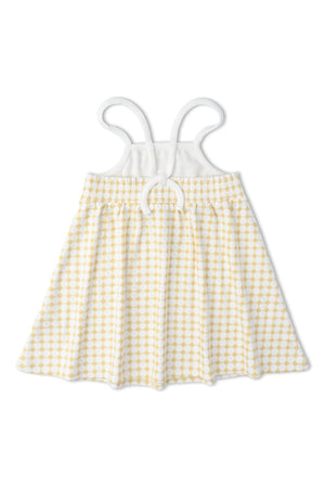 A yellow and white dotty gingham dress with adjustable tie-back straps and a gathered waist. This soft, breathable garment is perfect for young children.