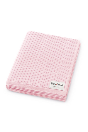 Pink ribbed knit blanket with a Bleu-La-La Organics label, made from organic cotton.