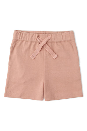 Soft, organic cotton shorts in a light pink hue feature a comfortable elastic waistband with a decorative tie. Perfect for summer adventures, these shorts are ideal for children.
