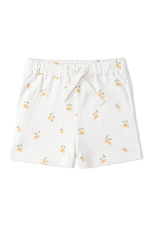 White shorts featuring a playful lemon print, made from soft organic cotton. These lightweight shorts are perfect for warm days and provide comfort for active play.