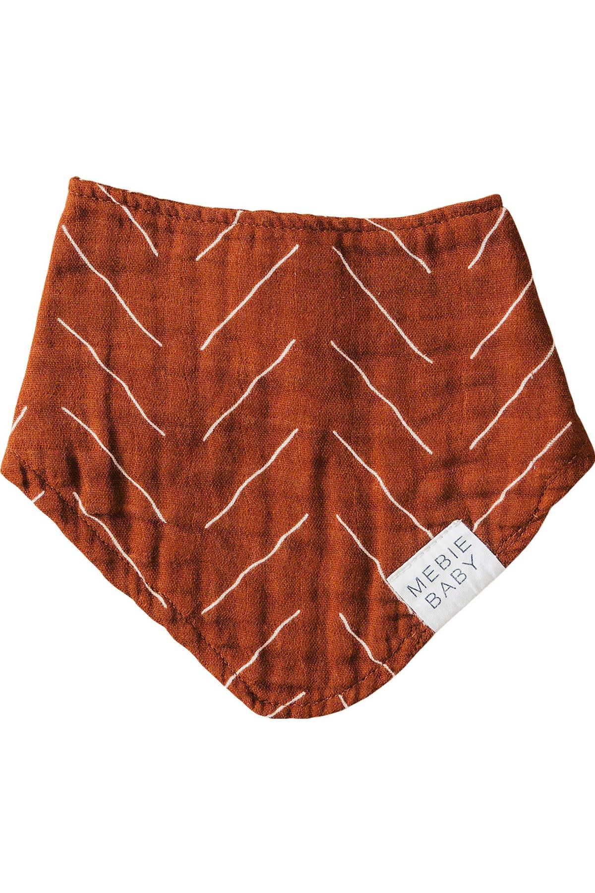 Rust-colored, bandana-style bib with white geometric lines, made of muslin fabric, featuring a Mebie Baby label.