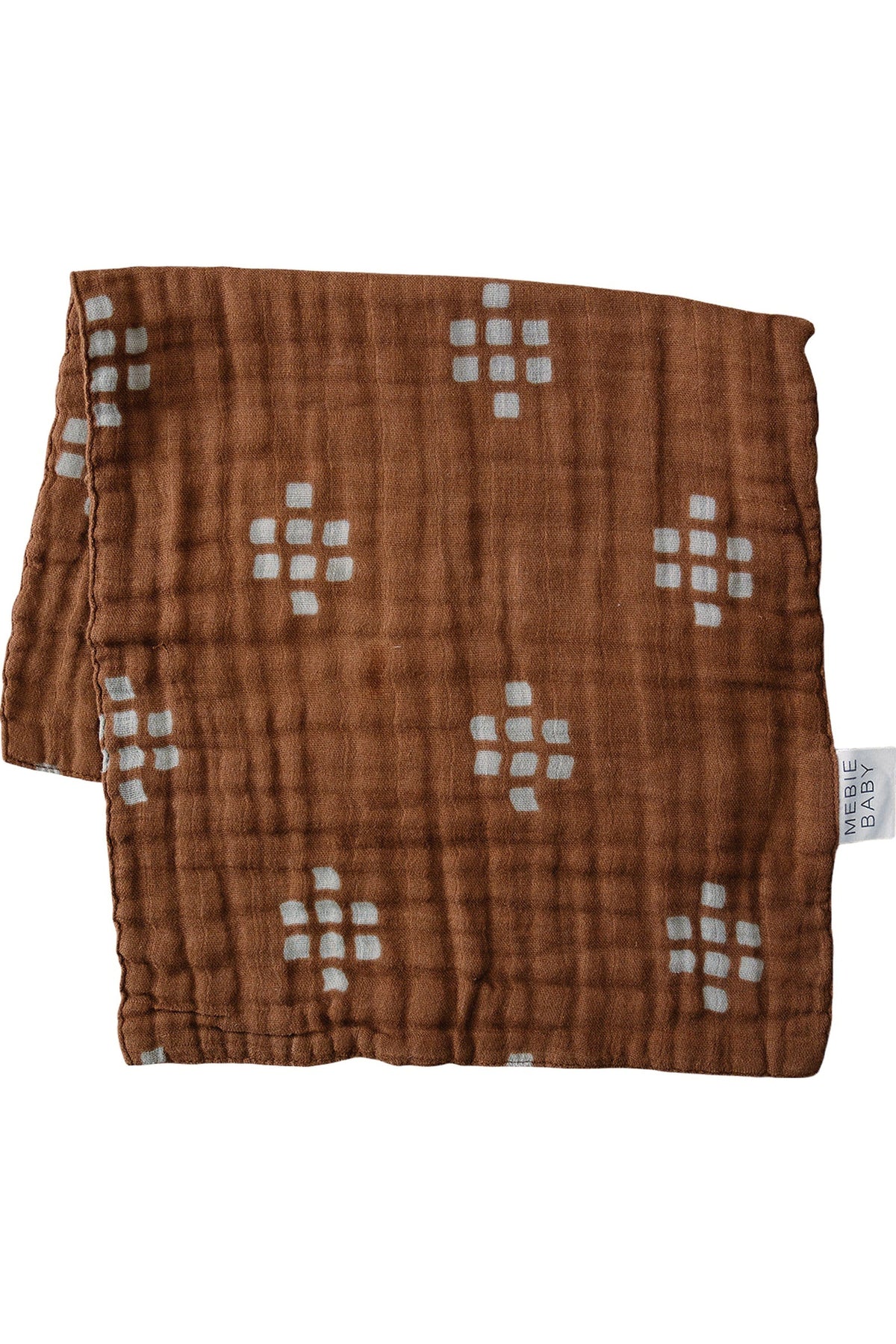 Brown muslin burp cloth with white geometric patterns, made of 100% cotton by Mebie Baby.