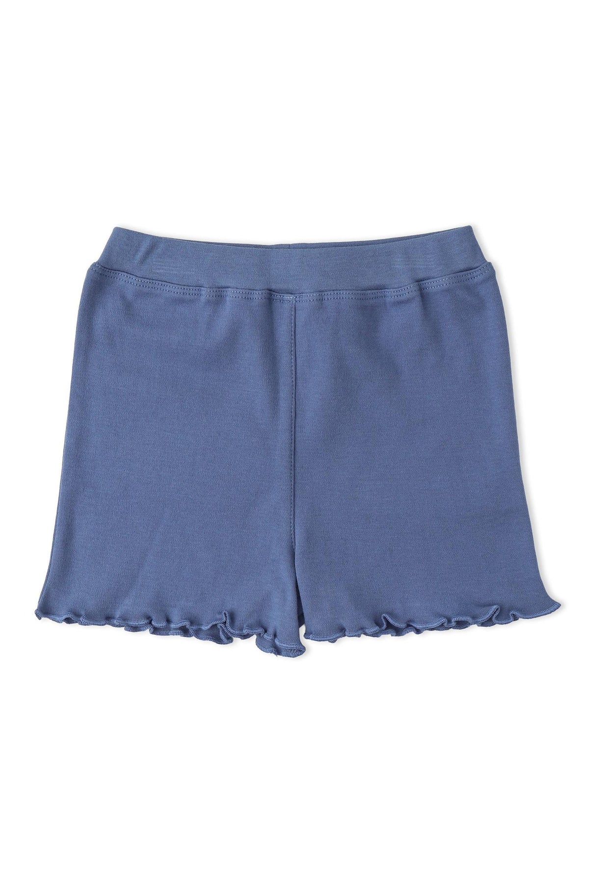A pair of soft, organic cotton shorts in a muted blue color features a ruffled hem. These comfortable shorts are perfect for casual wear during warm days.
