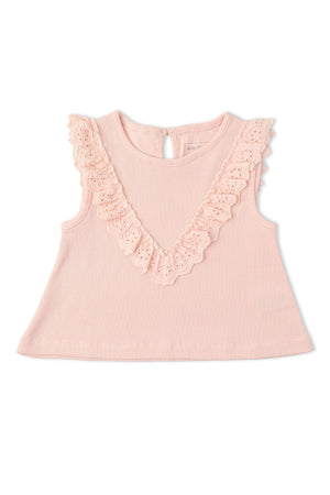 A blush pink sleeveless top features charming ruffles along the neckline and back keyhole detail. This organic cotton top is perfect for stylish comfort in warm weather.
