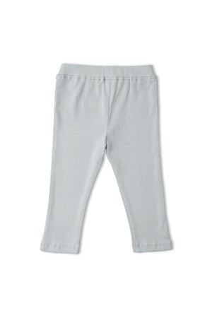 Light gray, ribbed leggings made from organic cotton, designed for comfort and movement. Ideal for playtime, these sustainable tights fit seamlessly into everyday outfits for young children.