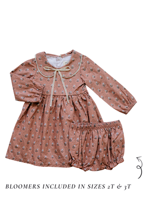 Pink floral dress with lace-edged Peter Pan collar and matching bloomers, made from cotton. Suitable for ages 2-3.