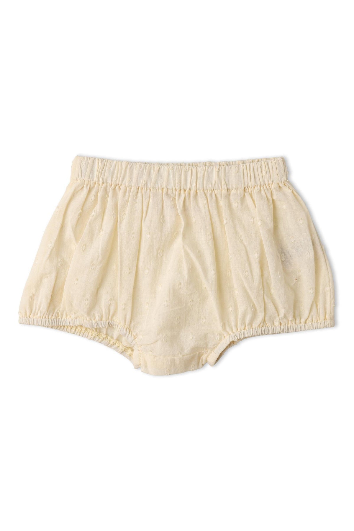 Soft butter yellow bloomers made from lightweight fabric, featuring an elastic waistband and delicate embroidered details. Ideal for comfortable wear, these organic cotton shorts are perfect for little ones.