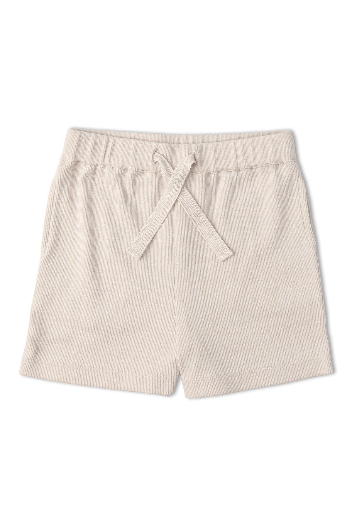 Light beige shorts made from soft, ribbed fabric feature an elastic waistband with a drawstring. Ideal for warm weather, these comfortable shorts are perfect for active playtime.