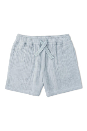 Light blue organic cotton shorts featuring a textured, crinkled fabric and an elastic waistband with a drawstring. Ideal for keeping kids comfortable during warm summer days.