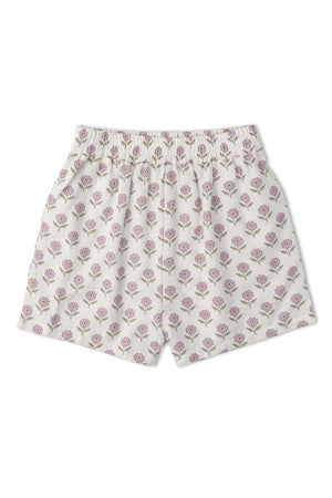 Light-colored shorts featuring a floral print in shades of pink and green. The waistband is elasticized for comfort, suitable for warm-weather play and crafted from organic materials.