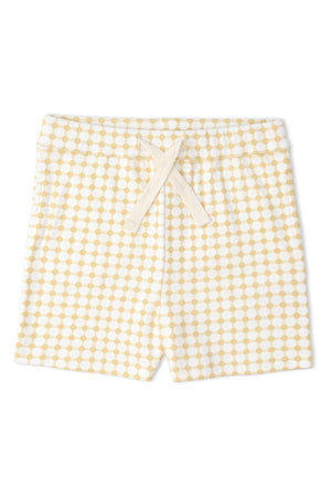 Organic cotton shorts in a yellow and white dot pattern, featuring an elastic waistband with a drawstring. Ideal for warm days, these shorts are soft and comfortable for active play.