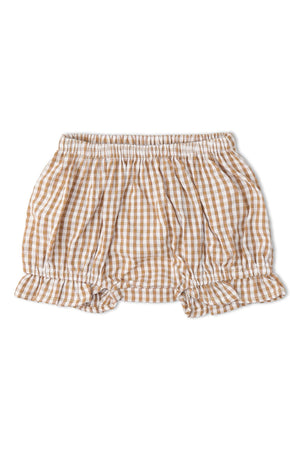 A caramel check bloomer featuring a soft, elastic waistband and delicate ruffle details at the hem. Made from organic cotton, this piece is perfect for little ones sunny day adventures.