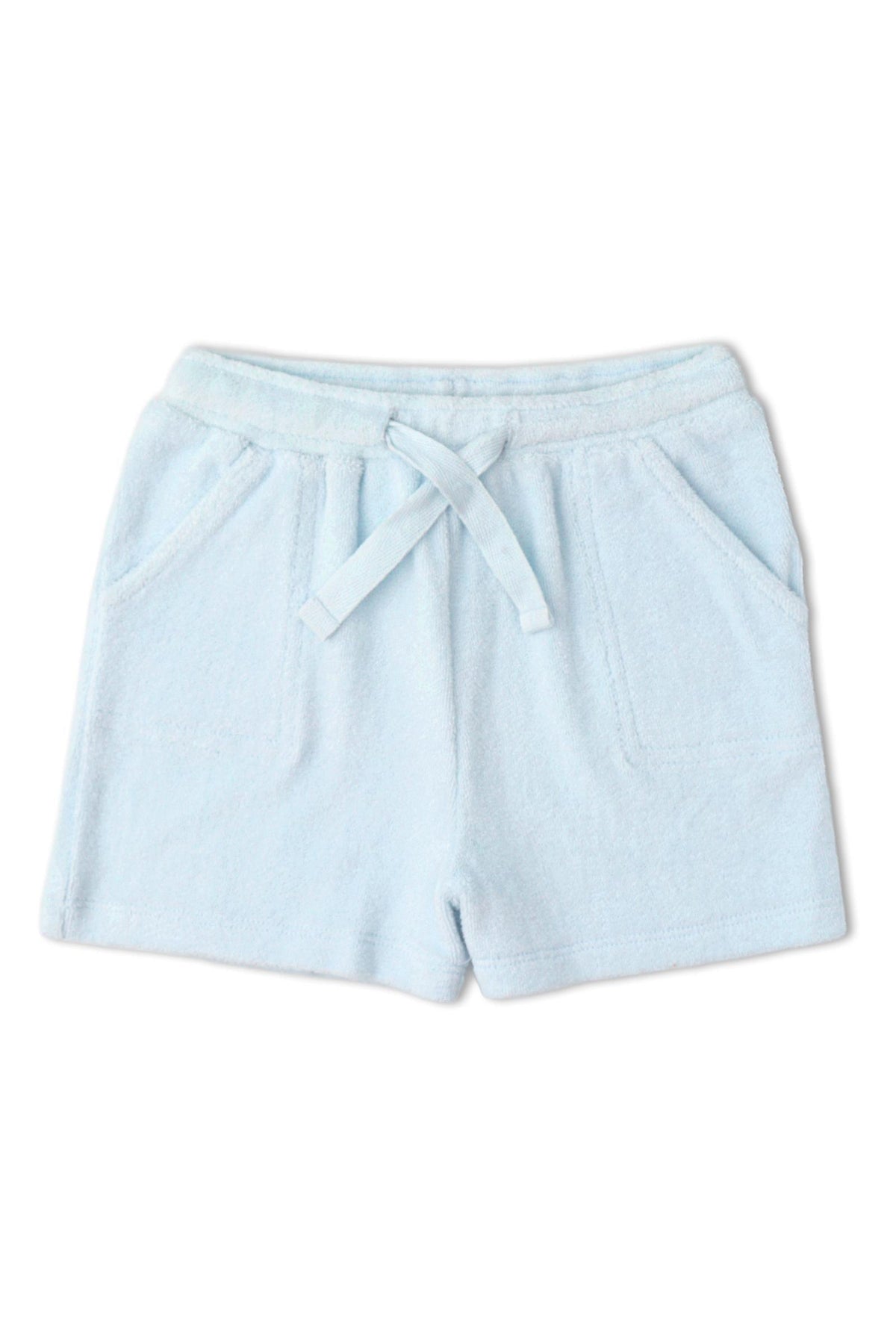 Light blue terry shorts featuring a soft, towel-like texture, an elastic waistband, and two front pockets. These comfortable shorts are designed for relaxed summer wear and everyday play.