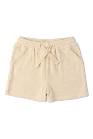 Soft, butter yellow terry shorts featuring a relaxed fit and adjustable drawstring waistband. These comfortable shorts are ideal for warm weather and casual play, made from breathable organic fabric.