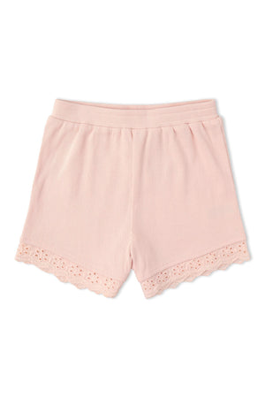Light pink ribbed shorts featuring a delicate scalloped lace trim at the hem. Made from soft, organic cotton, these comfortable shorts are perfect for everyday wear in warm weather.