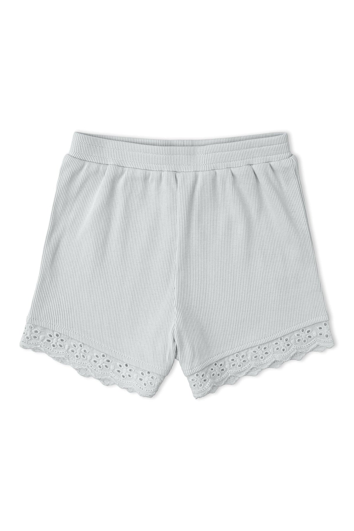Light gray organic cotton shorts feature a ribbed texture and delicate lace trim at the hem. These comfortable, sustainable shorts are perfect for casual wear and everyday play.