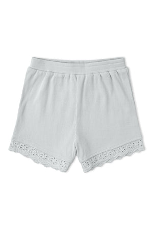 Light gray organic cotton shorts feature a ribbed texture and delicate lace trim at the hem. These comfortable, sustainable shorts are perfect for casual wear and everyday play.