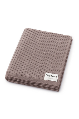 A folded taupe ribbed knit blanket made from 100% organic cotton with a label reading Bleu-La-La Organics.