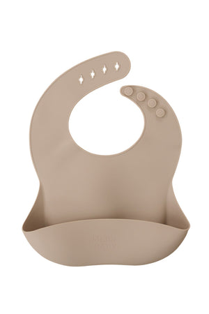 Beige silicone bib with adjustable button closure and a pocket, featuring the Mebie Baby brand name embossed.